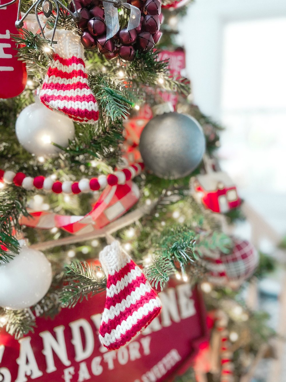 Candy Cane Themed Christmas Tree. Celebrate Christmas with a festive red and white tree filled with candy cane-themed projects, bells and felted garlands. 