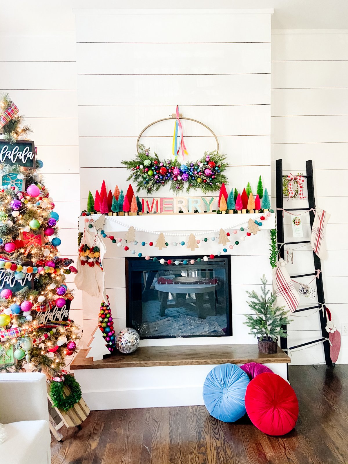 Bright Colorful Merry Mantel. Create colorful holiday cheer with a bright garland, little bottlebrush trees and an embroidery hoop ornament wreath!