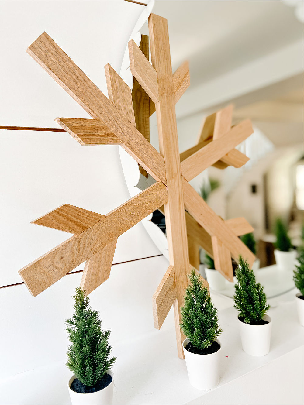 DIY Giant Farmhouse Wood Snowflake. Celebrate Winter by making a gorgeous giant wood snowflake to hang up or place on your mantel!