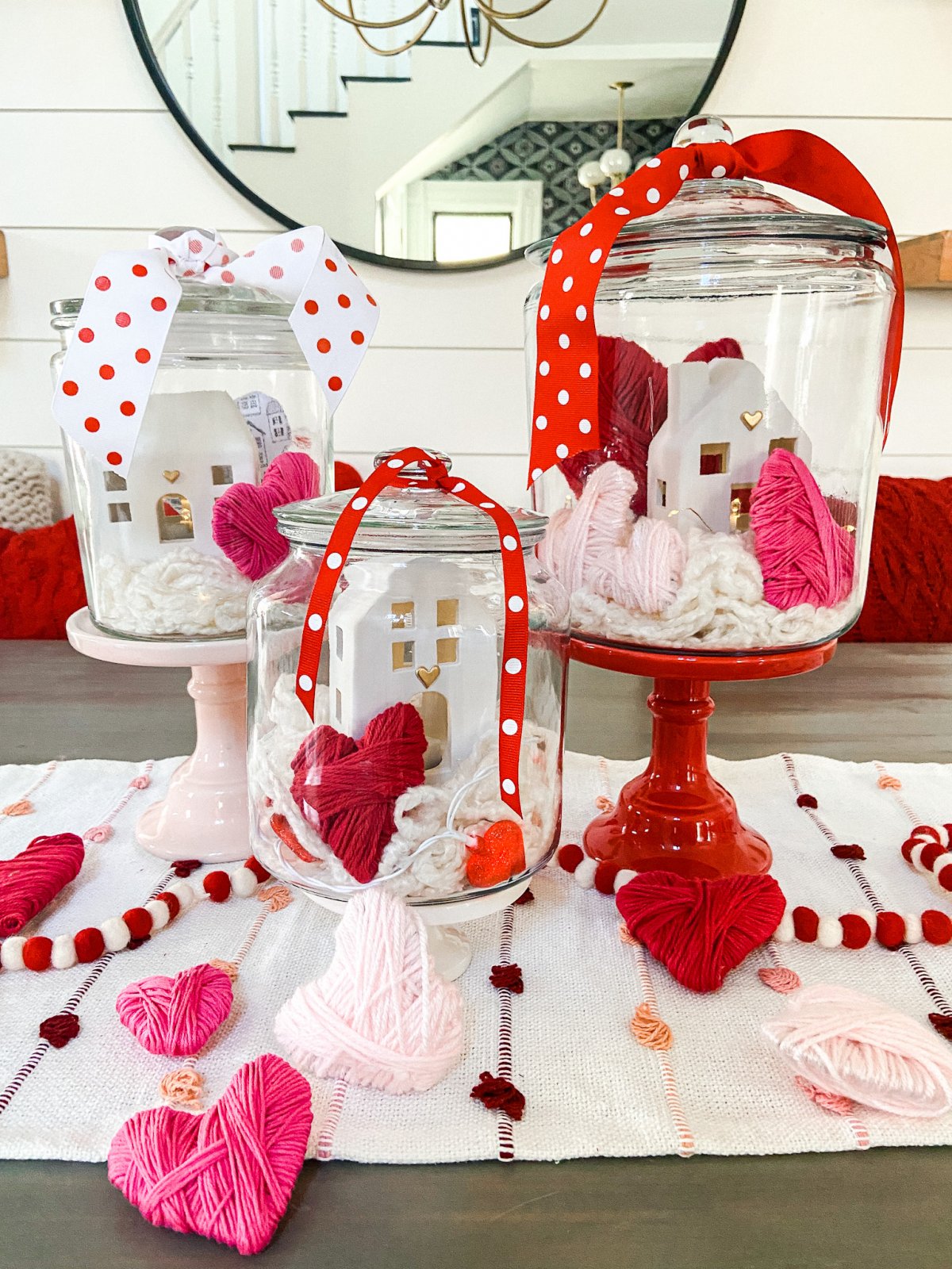 Valentine's Day Yarn-Wrap Cardboard Hearts + Centerpiece. Yarn-wrapped cardboard hearts are so simple to make and can be used for all kinds of Valentine's Day crafts. Add them to clear jars for a pretty centerpiece idea!