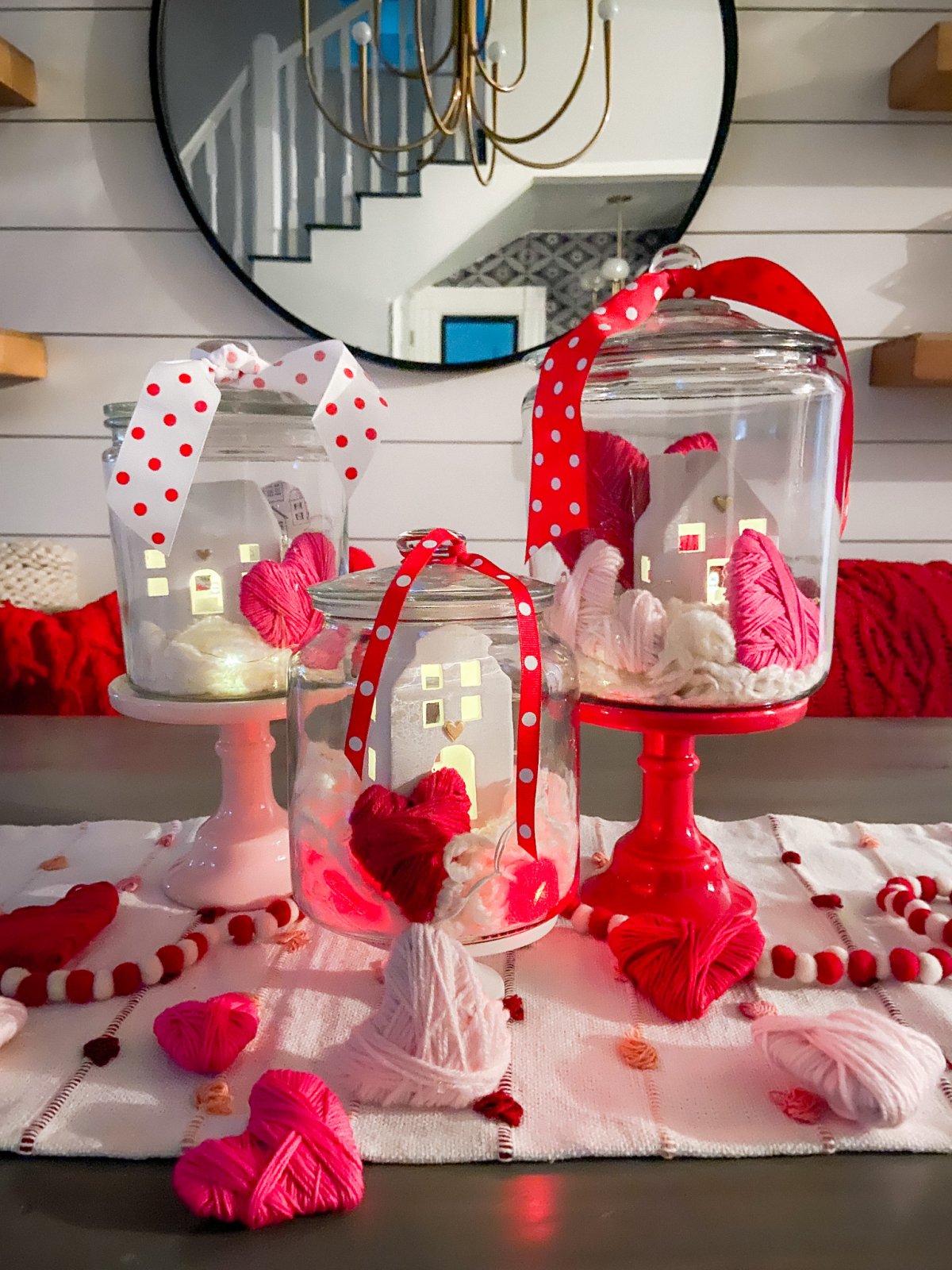 Valentine's Day Yarn-Wrap Cardboard Hearts + Centerpiece. Yarn-wrapped cardboard hearts are so simple to make and can be used for all kinds of Valentine's Day crafts. Add them to clear jars for a pretty centerpiece idea!