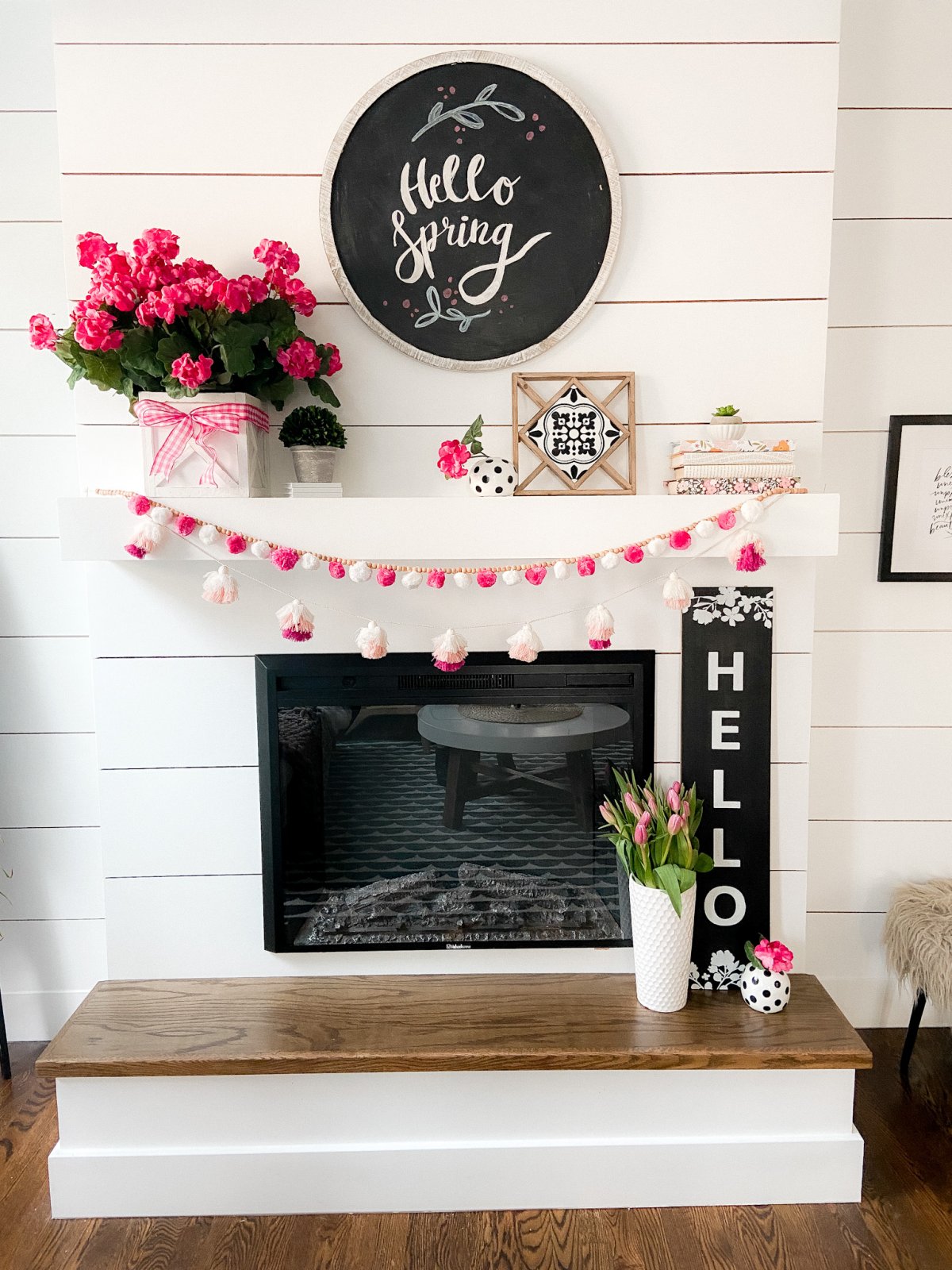 Colorful Spring Mantel with DIY Chalkboard Sign. Add spring color to your home with bright flowers, pretty accents and a DIY chalkboard!