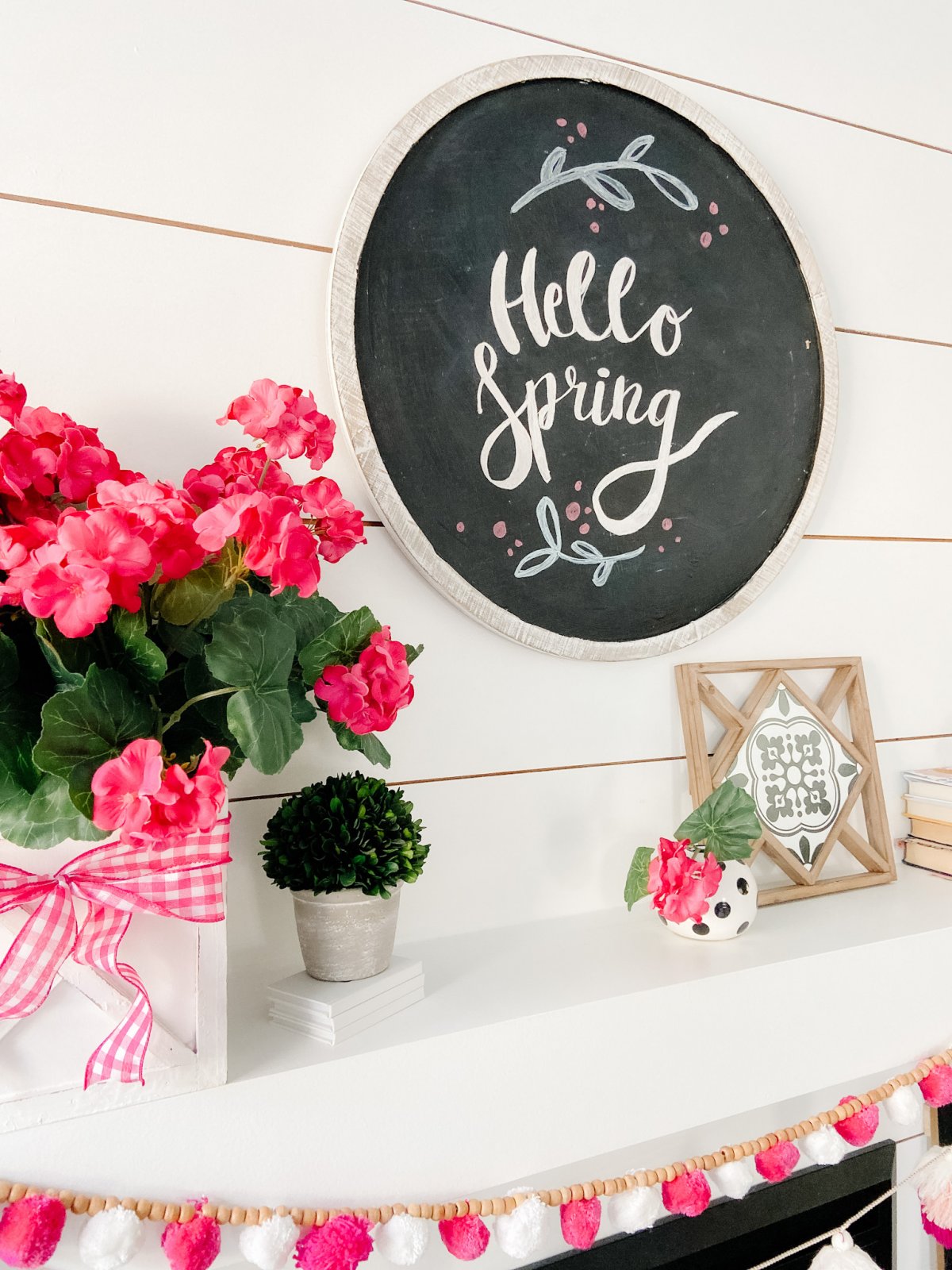 Colorful Spring Mantel with DIY Chalkboard Sign. Add spring color to your home with bright flowers, pretty accents and a DIY chalkboard!