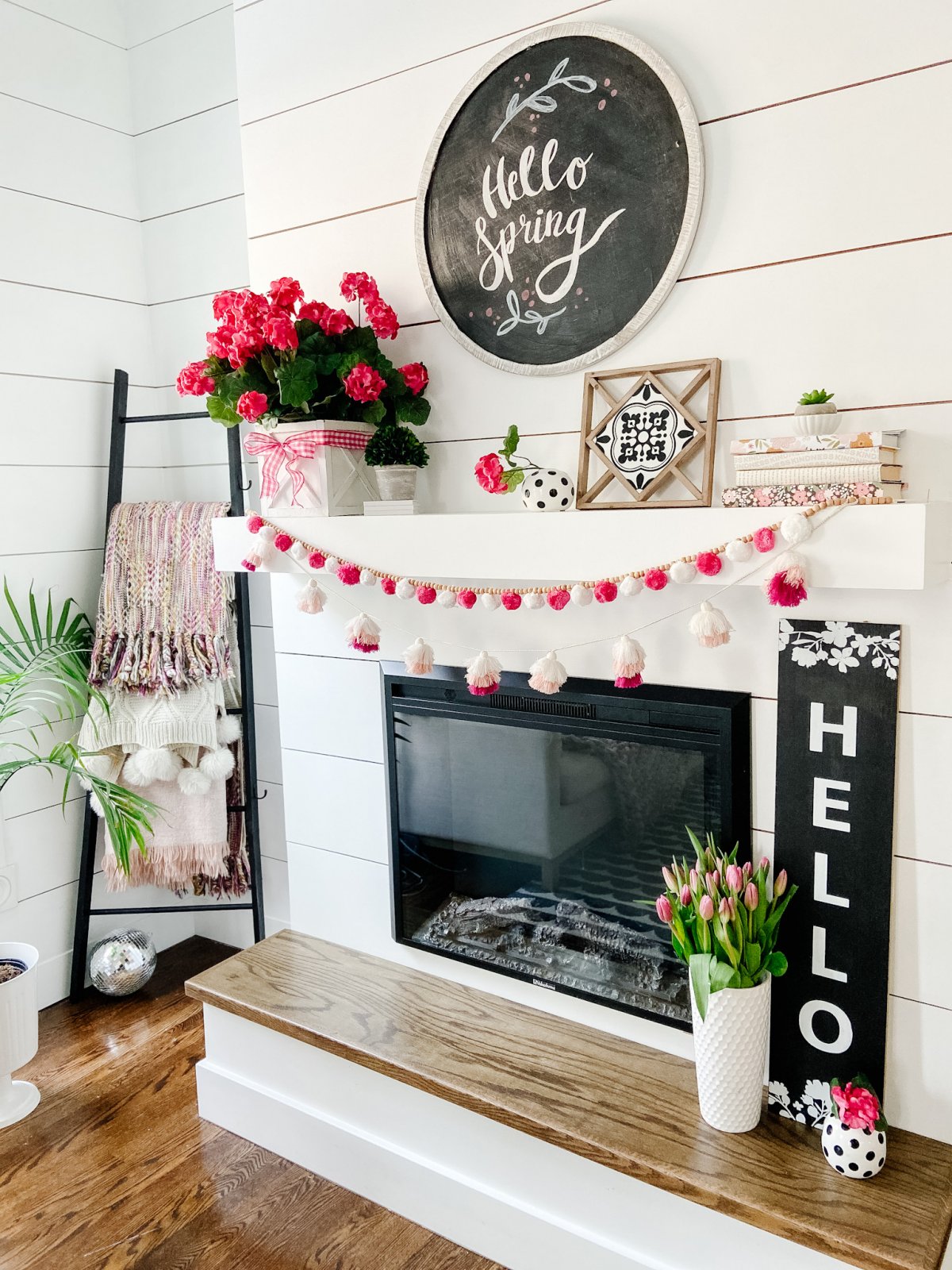 Colorful Spring Mantel with DIY Chalkboard Sign. Add spring color to your home with bright flowers, pretty accents and a DIY chalkboard!