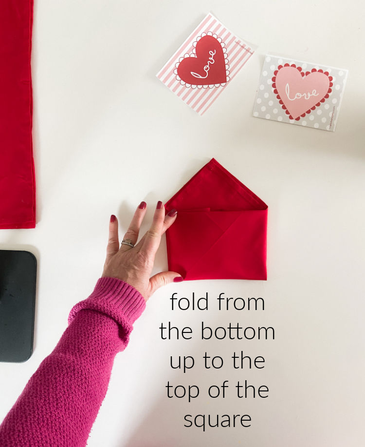 Valentine's Day Table Envelope Napkins. Fold napkins in an envelope shape and add a special hand-written note with free printable cards!