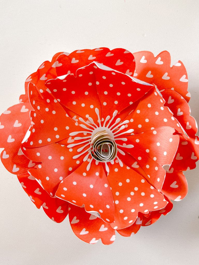Spring Paper Flower Hoop Wreath. Turn scrapbook paper and a metal wreath form into a pretty spring wreath using a Sizzix die cut machine.
