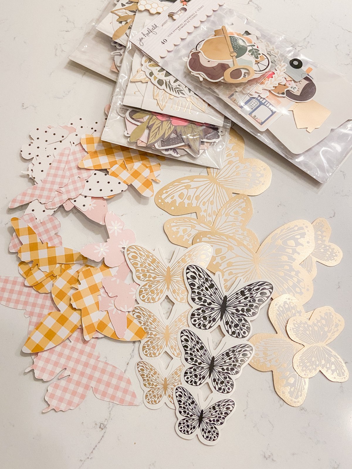 Spring Butterfly Pennant Wreath. Celebrate spring by making this simple wreath with butterflies cut out of cardstock and a big pennant in the middle and a spring saying!