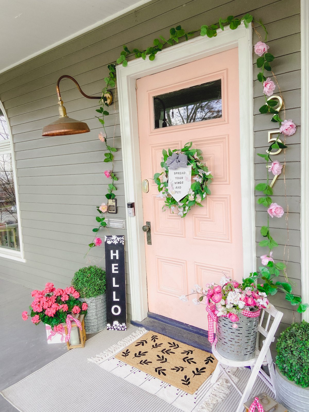 Spring Butterfly Pennant Wreath. Celebrate spring by making this simple wreath with butterflies cut out of cardstock and a big pennant in the middle and a spring saying!