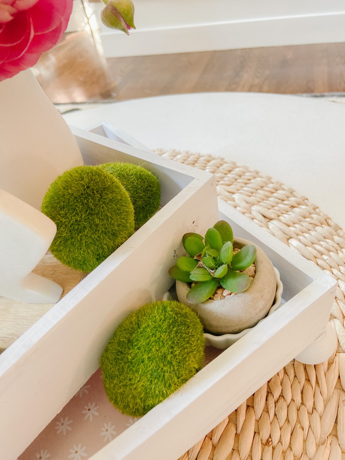 DIY Spring Footed Stacking Tray Centerpiece. Add ball feet to simple wood boxes, add scrapbook paper and layer with fresh flowers and spring items for a pretty centerpiece! 