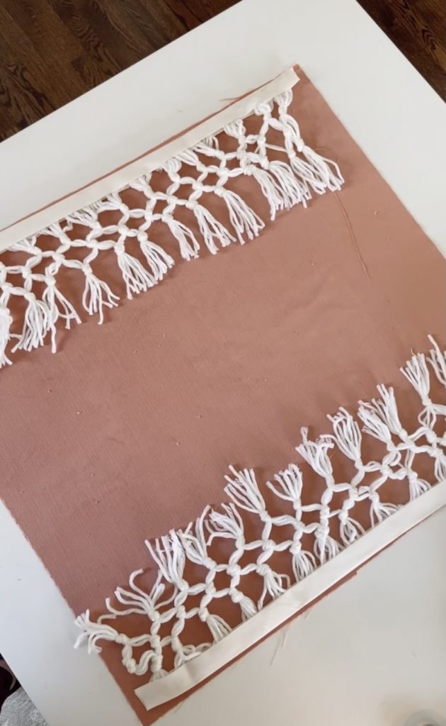 Envelope Pillow Cover with Macrame Fringe Trim. Add a little boho detail to your next pillow with this easy fringe idea and easy pillow!