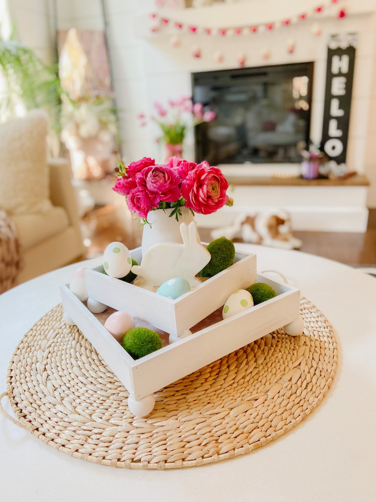 DIY Spring Footed Stacking Tray Centerpiece. Add ball feet to simple wood boxes, add scrapbook paper and layer with fresh flowers and spring items for a pretty centerpiece! 