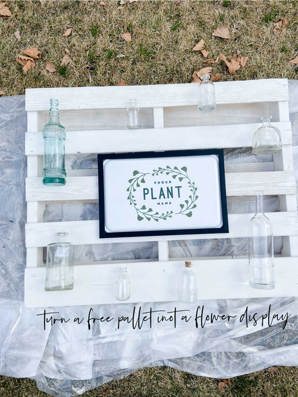 DIY Spring Pallet Flower Mantel. Turn a free pallet into a beautiful vertical flower and sign display that can be changed out seasonally!