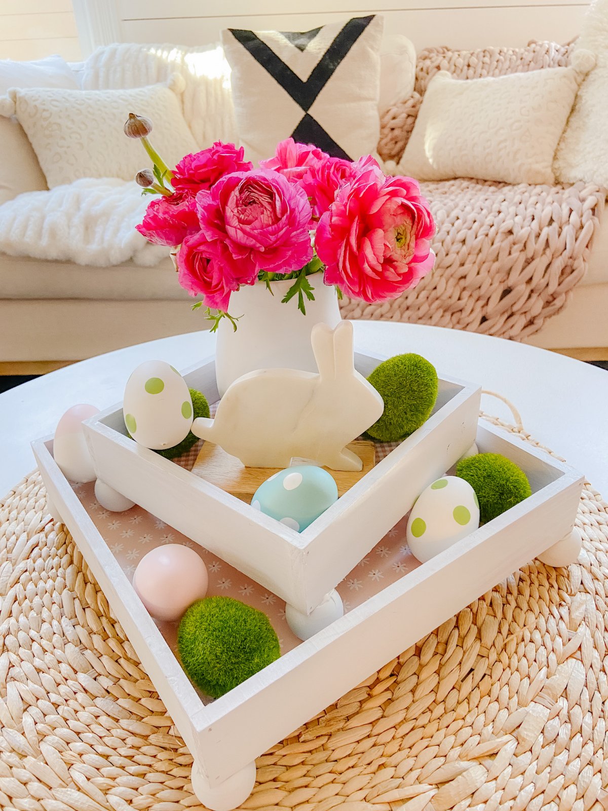 DIY Spring Footed Stacking Tray Centerpiece. Add ball feet to simple wood boxes, add scrapbook paper and layer with fresh flowers and spring items for a pretty centerpiece! 