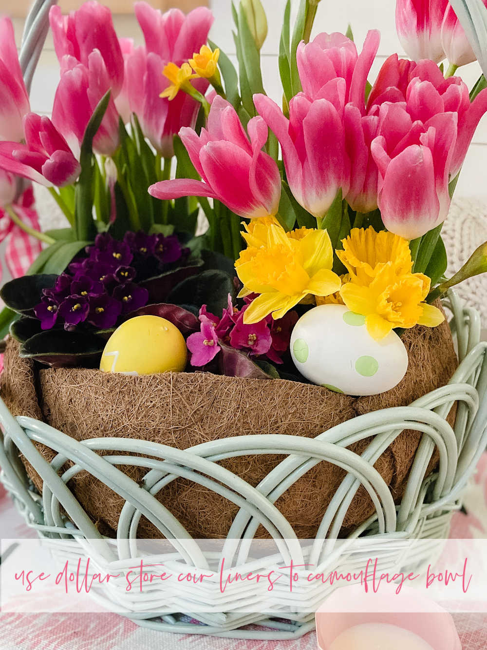 Easter Basket Living Floral Centerpiece. Take an Easter basket, plant flowers inside and cover with a dollar store coir liner for a beautiful spring living centerpiece.