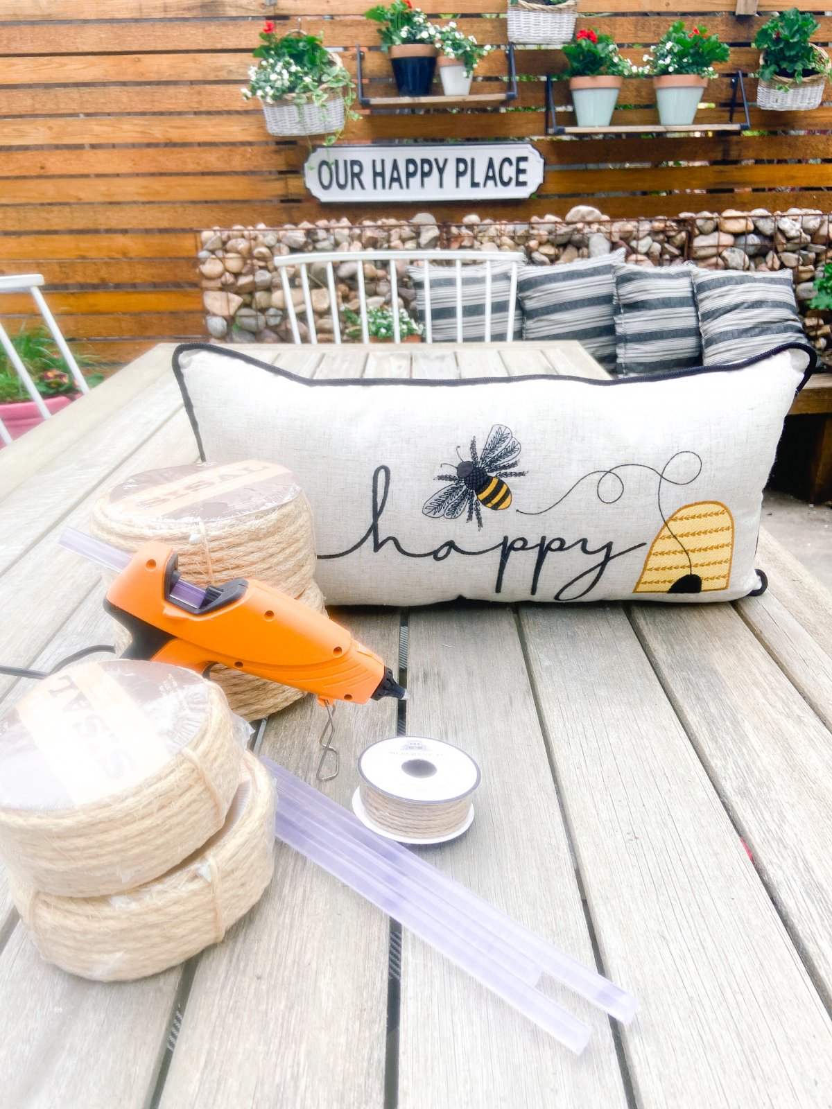 DIY Beehives and Beehive Backyard Inspo! Create cute and inexpensive beehives, add beehive pillows and create a hanging basket garden for a beautiful summer patio!