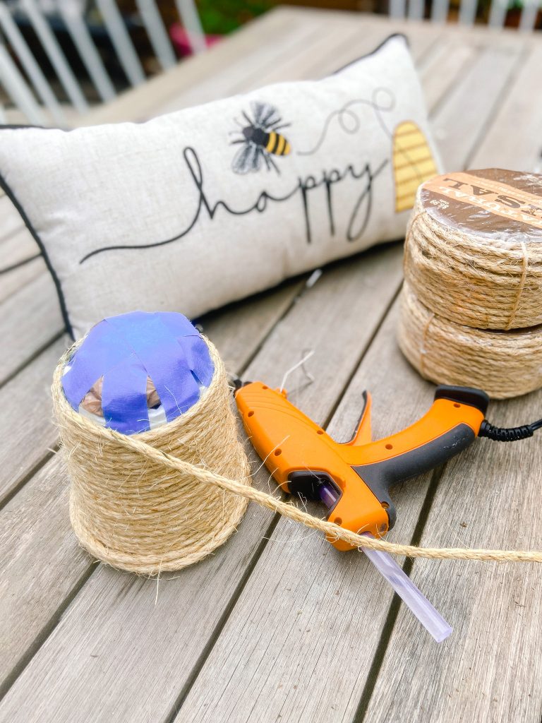 DIY Beehives and Beehive Backyard Inspo! Create cute and inexpensive beehives, add beehive pillows and create a hanging basket garden for a beautiful summer patio!