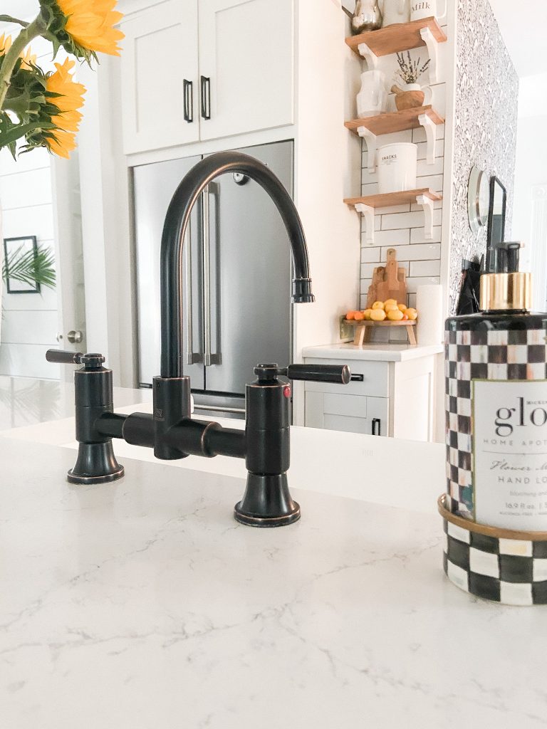 Black and white kitchen remodel with a Peerless kitchen faucet 