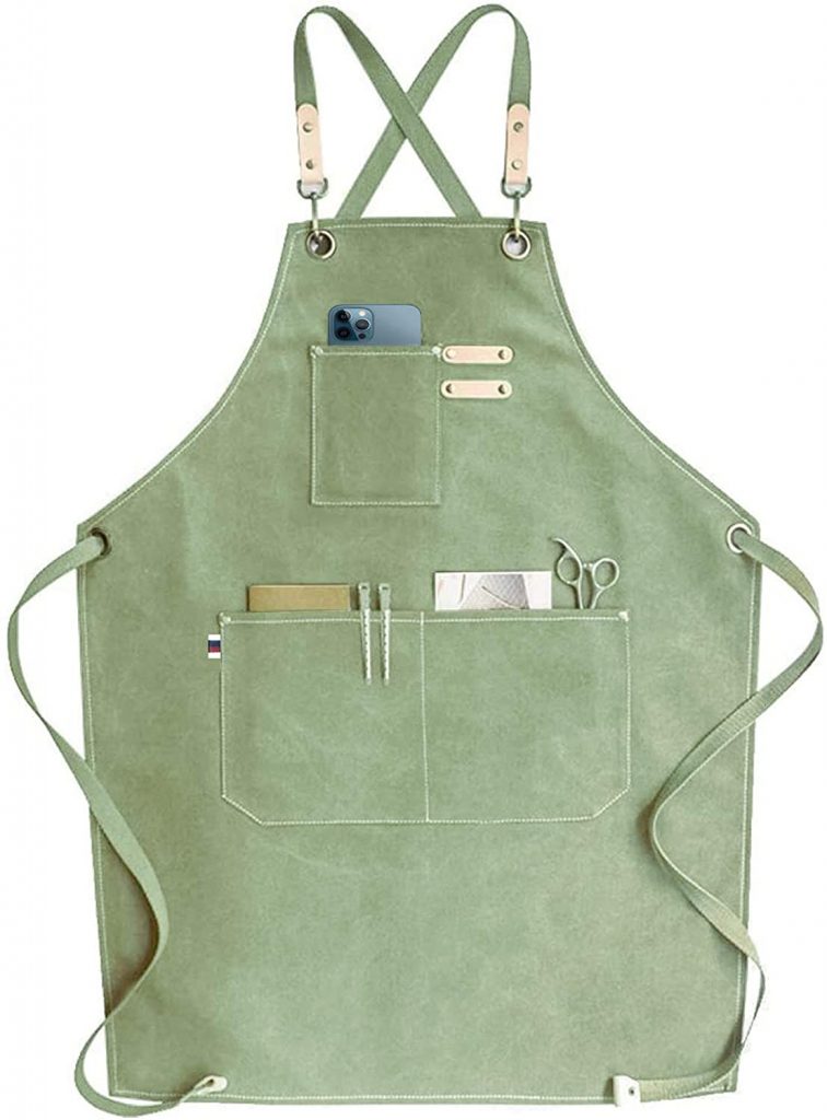 https://tatertotsandjello.com/wp-content/uploads/2021/04/chef-apron-with-pockets-756x1024.jpg