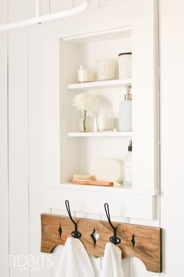 between the studs bathroom cabinet