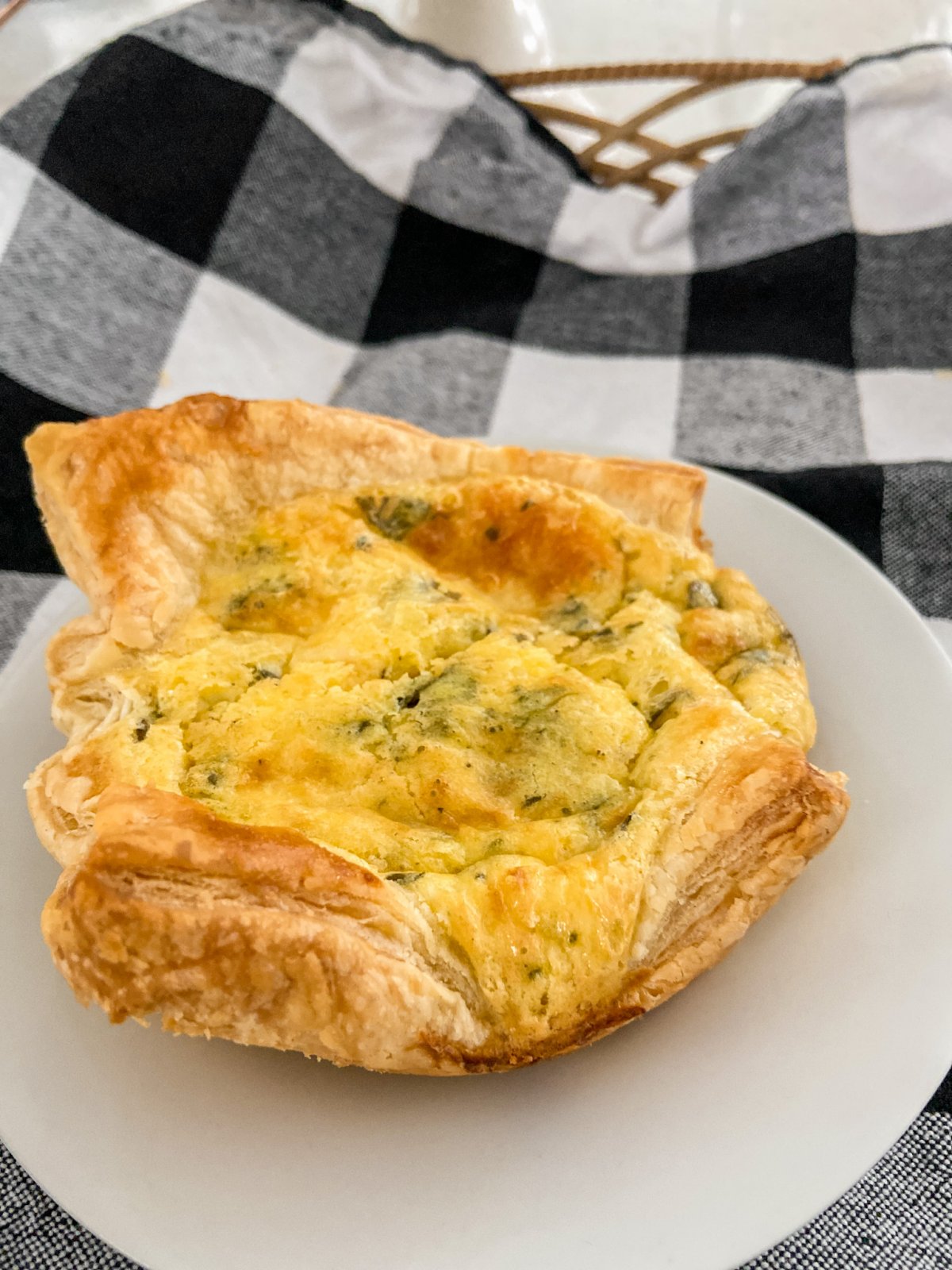 Copycat Panera Spinach and Artichoke Egg Soufflés. Fluffy eggs in a delicious spinach artichoke batter baked in layers of light flakey crust will impress weekend guests and the best part is they are SO easy to make! 
