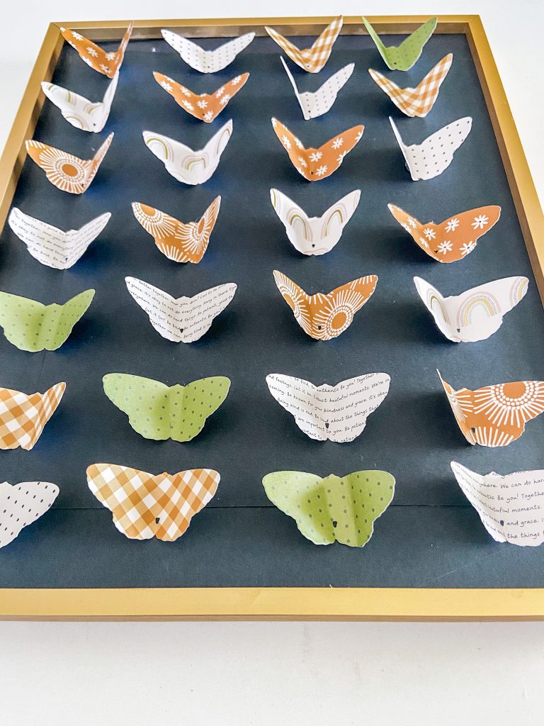 Butterfly Paper Specimen Art and Mantel. Use scrapbook paper and a butterfly die cut to create a three-dimensional and whimsical specimen art for a summer mantel! 