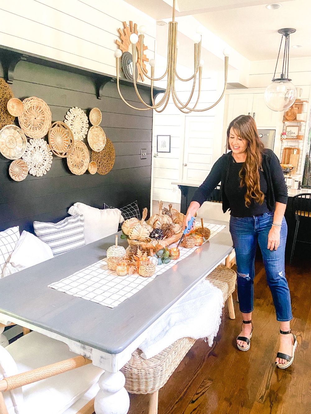 Boho Cottage Fall Tablescape. Create a warm and inviting table by making a DIY table runner, pillows and a beautiful footed bowl centerpiece filled with textured, fabric-covered pumpkins and leaves.