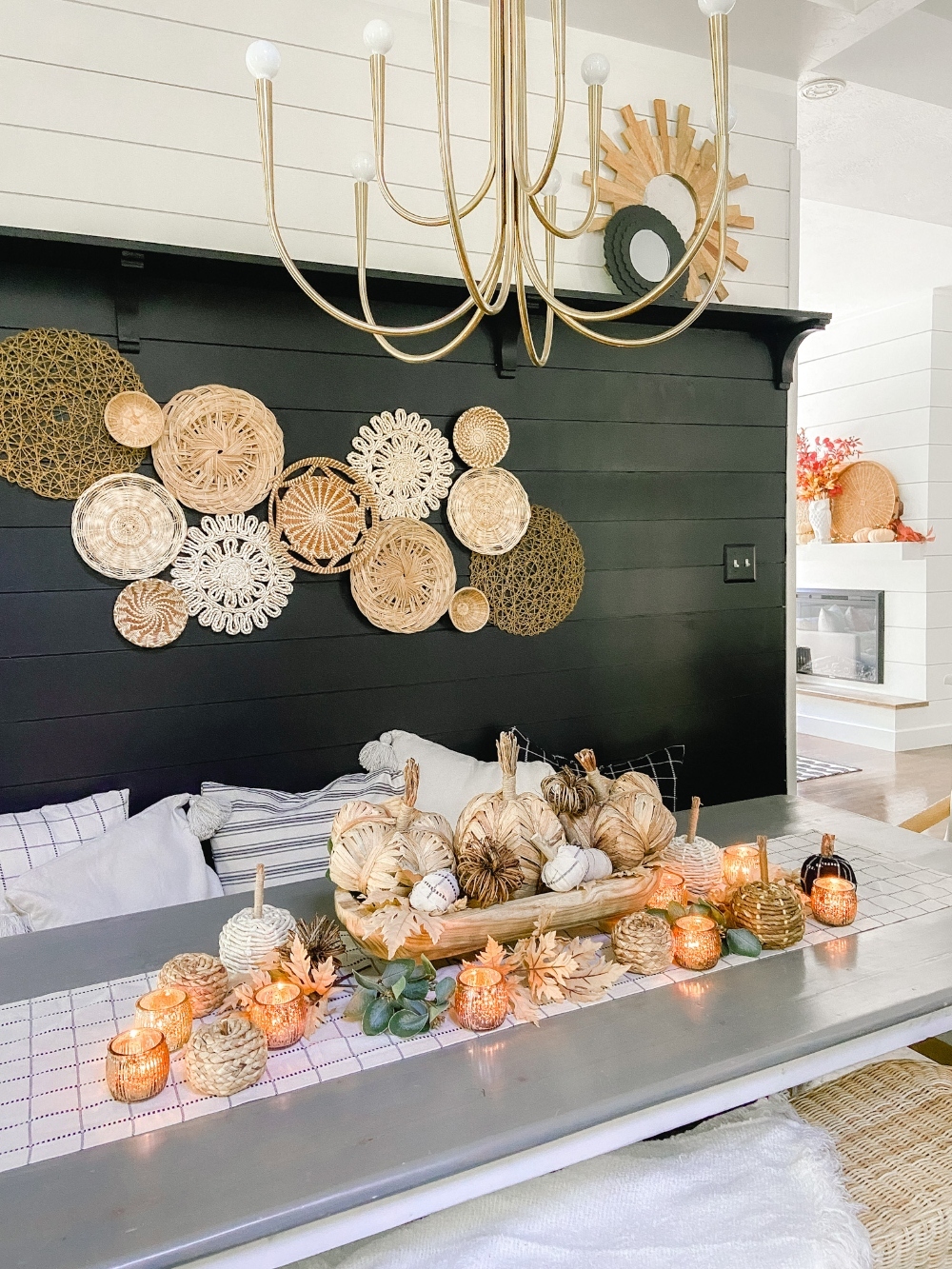 Boho Cottage Fall Tablescape. Create a warm and inviting table by making a DIY table runner, pillows and a beautiful footed bowl centerpiece filled with textured, fabric-covered pumpkins and leaves.