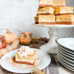 Triple Layer Pumpkin Cheesecake Bars. Creamy layers of cheesecake and pumpkin cheesecake with a ginger cinnamon crust for a low-carb treat perfect for Fall!