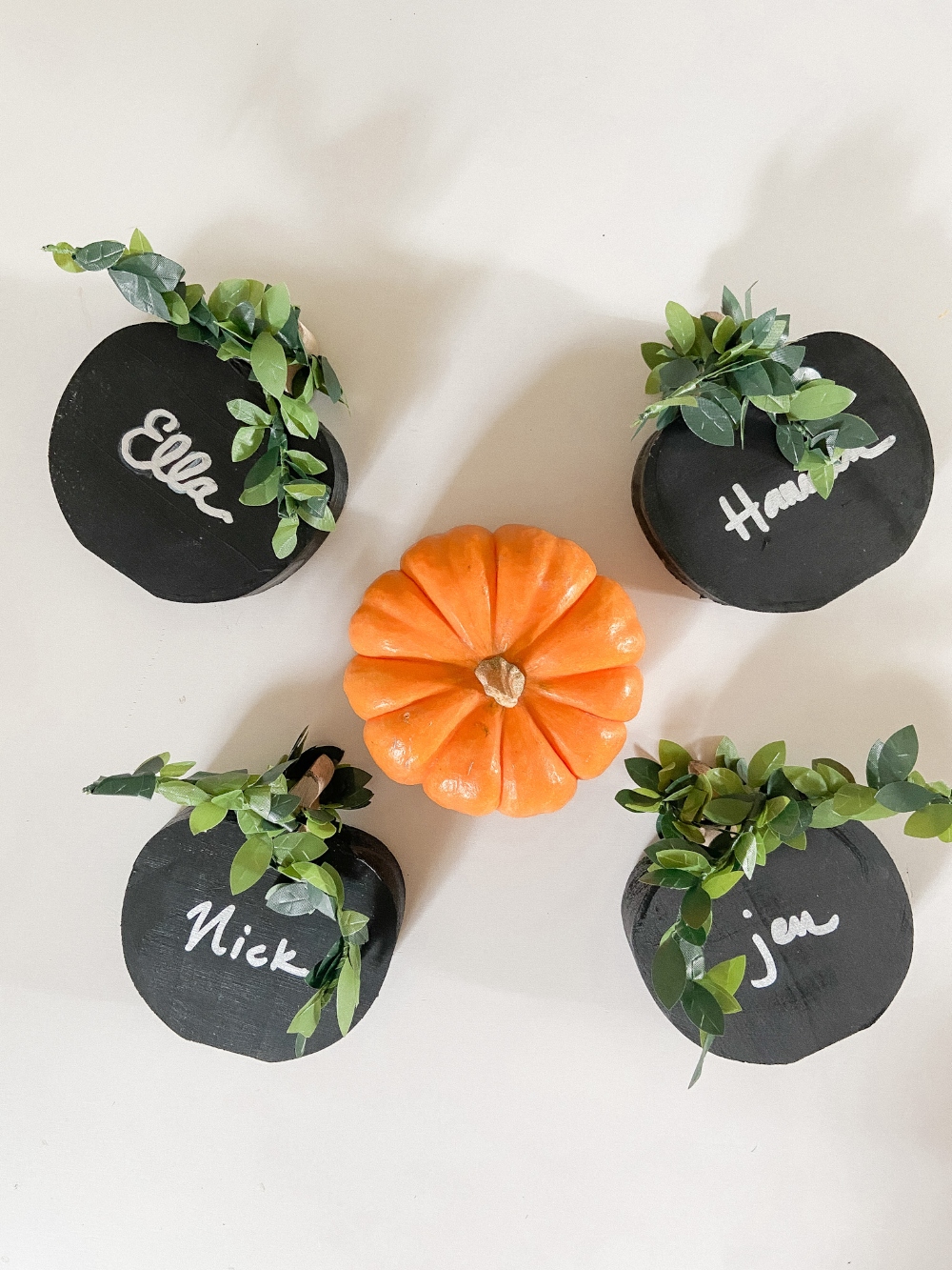 DIY Wood Chalkboard Pumpkin Place Markers. Get ready for fall entertaining by making these easy pumpkin-shaped wood chalkboard place markers! It’s a 10-minute project that can be used all autumn long!