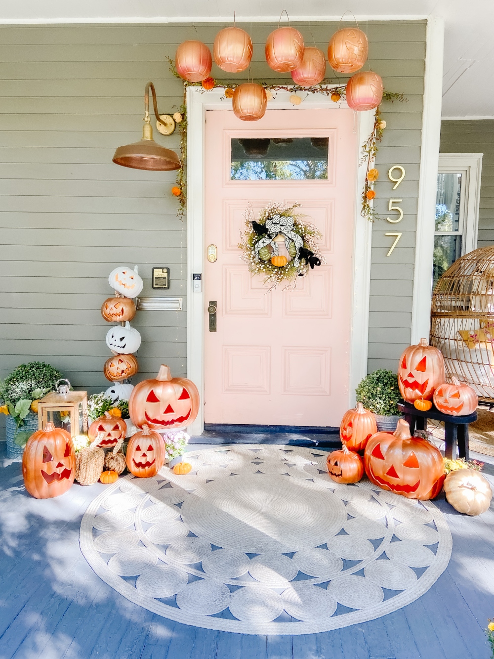 The Great Pumpkin Halloween Porch! Spray paint inexpensive jack-o-lanterns, pumpkin pails and make a jack-o-lantern topiary for a festive pumpkin porch!