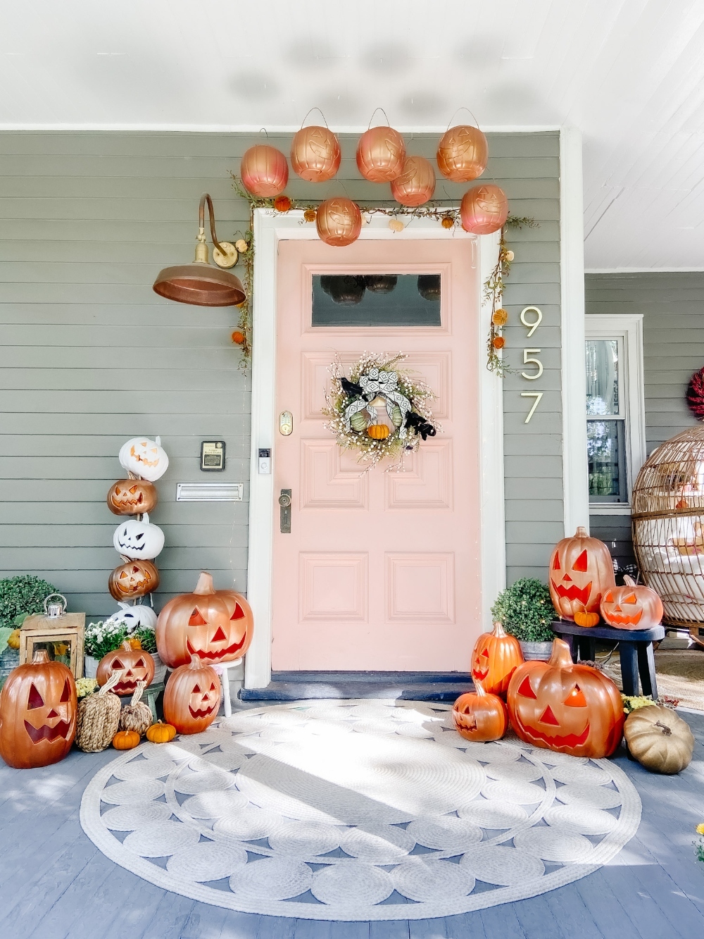 The Great Pumpkin Halloween Porch! Spray paint inexpensive jack-o-lanterns, pumpkin pails and make a jack-o-lantern topiary for a festive pumpkin porch! 