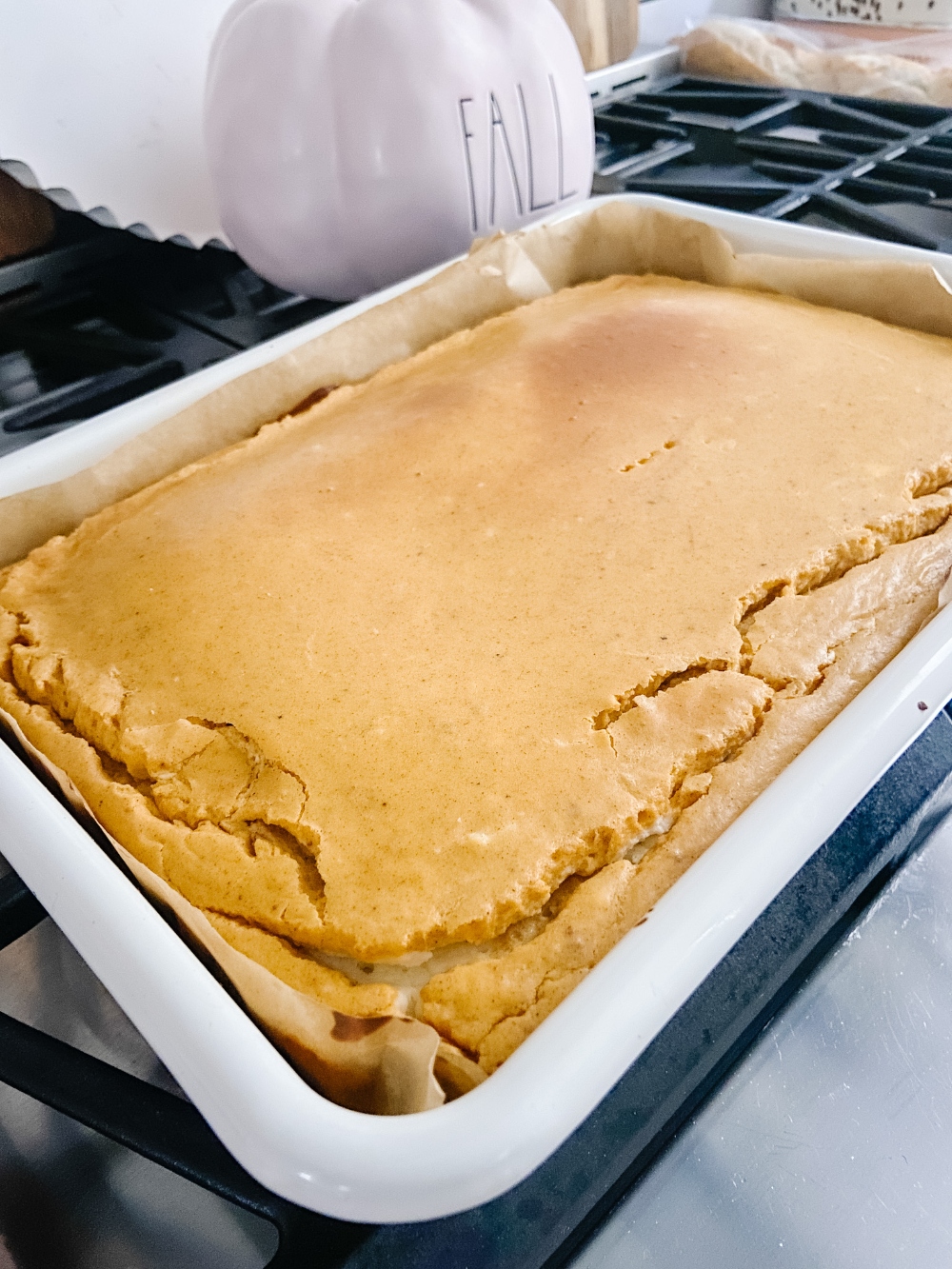 Triple Layer Pumpkin Cheesecake Bars. Creamy layers of cheesecake and pumpkin cheesecake with a ginger cinnamon crust for a low-carb treat perfect for Fall!