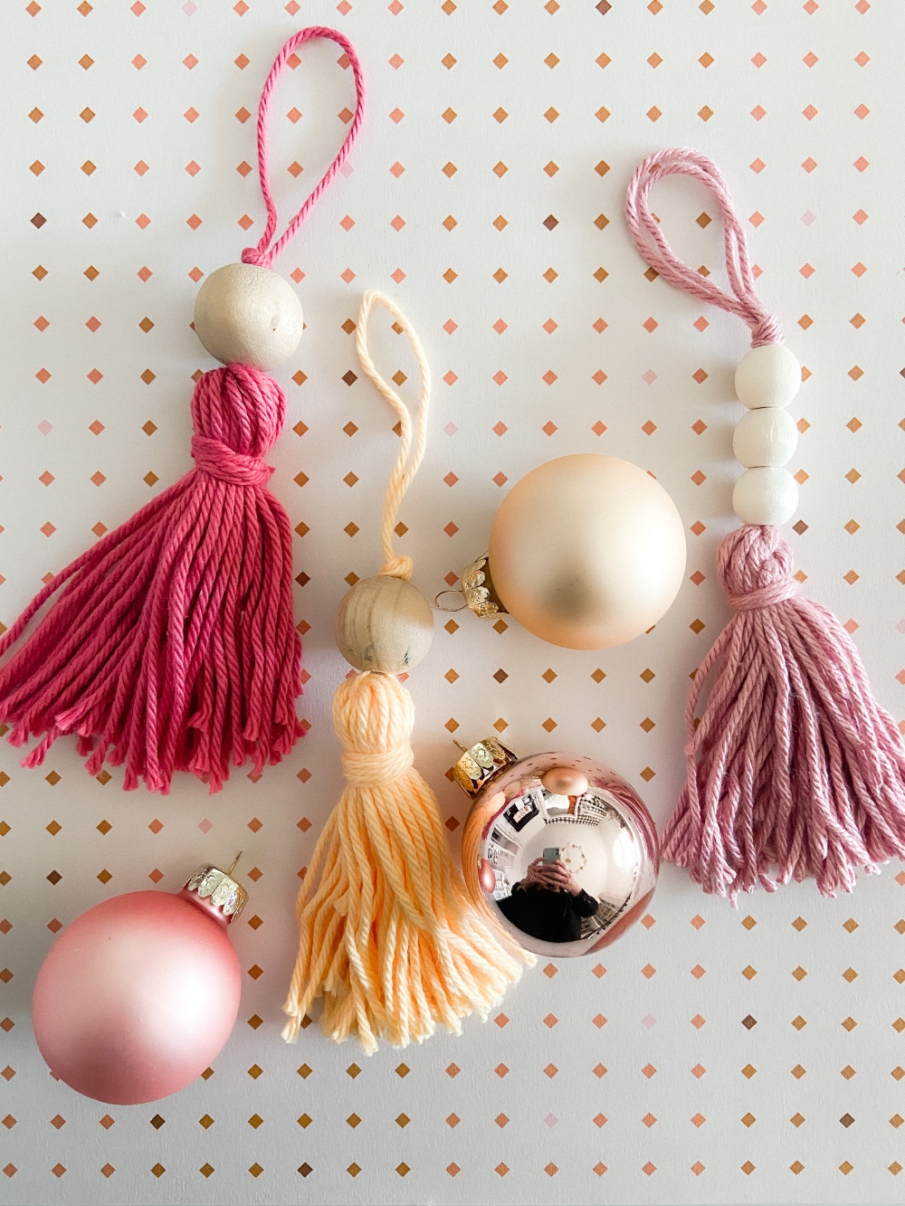 5-Minute Boho Tassel Ornaments. DIY Ornaments don't have to be complicated or expensive. All you need is yarn and beads! 