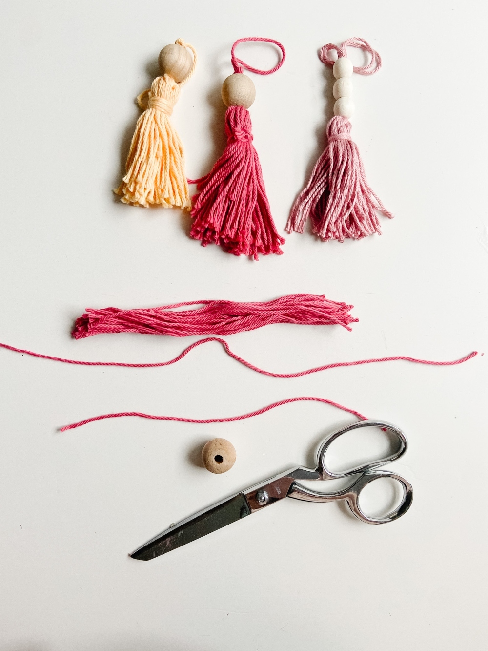 5-Minute Boho Tassel Ornaments. DIY Ornaments don't have to be complicated or expensive. All you need is yarn and beads! 