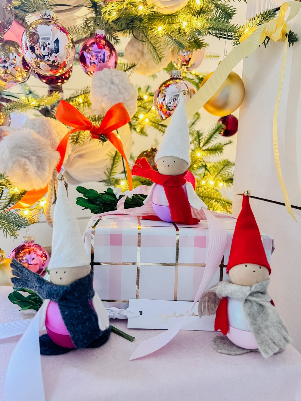 DIY EOS Holiday Gnomes Craft! Add colorful felt to EOS lip balms and transform them into the sweetest gnomes with lip balm inside. The perfect gift idea or present topper! 