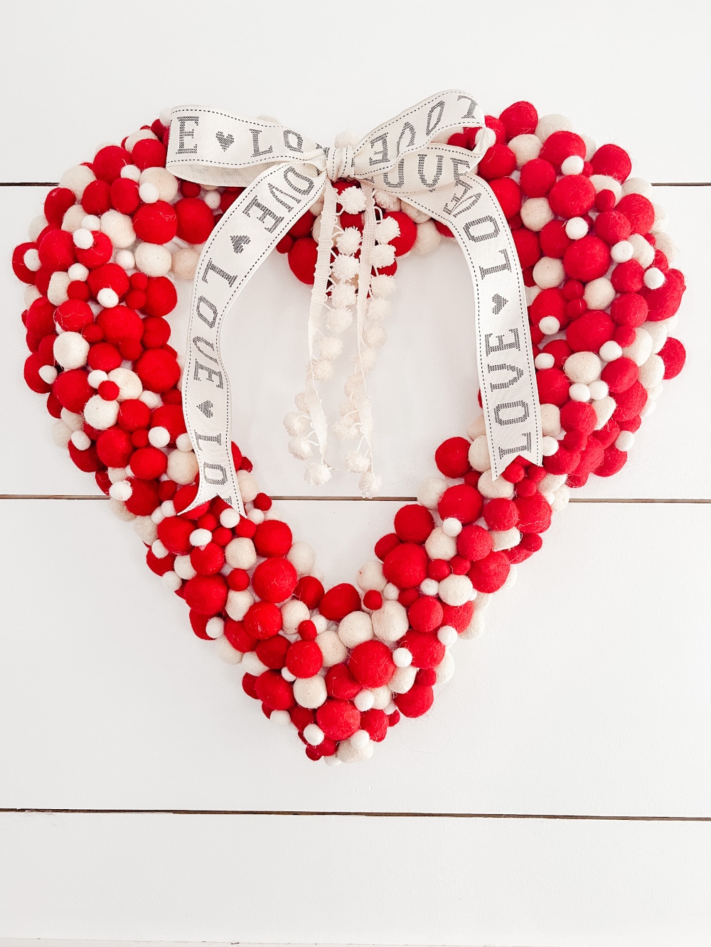 Christmas Garland to Valentine Wreath! Upcycle a Christmas garland and turn it into a fun and festive Valentine decoration!