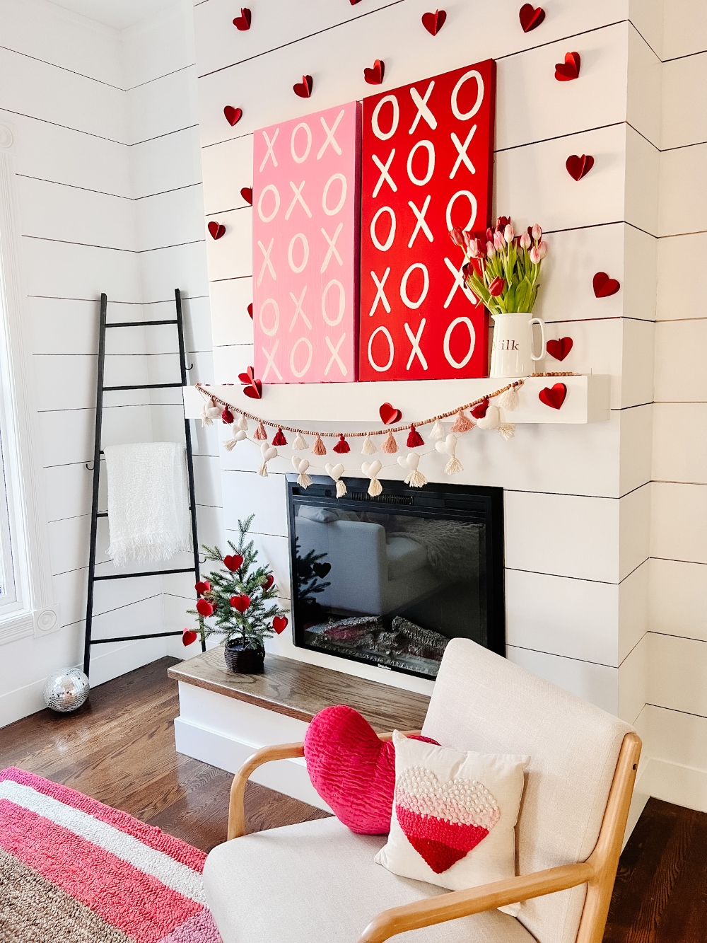 Valentine XOXO Mantel Ideas. Upcycle and paint some easy XOXO signs, add paper hearts and you have an adorable mantel or shelf vignette! 