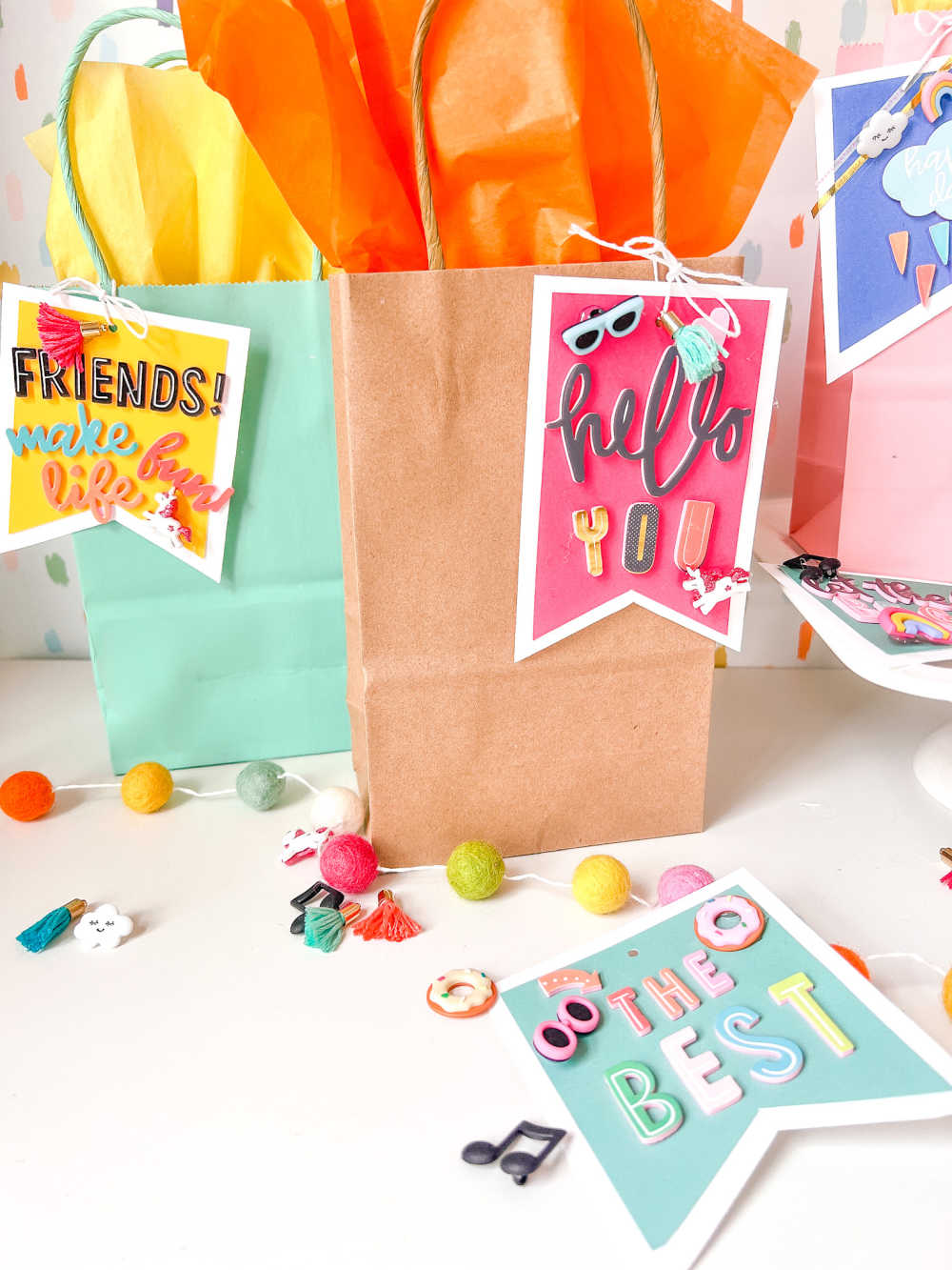 Easy 5-Minute Gift Tags! Create bright and happy gift tags for anyone using paper and embellishments from The Paper Studio at Hobby Lobby!
