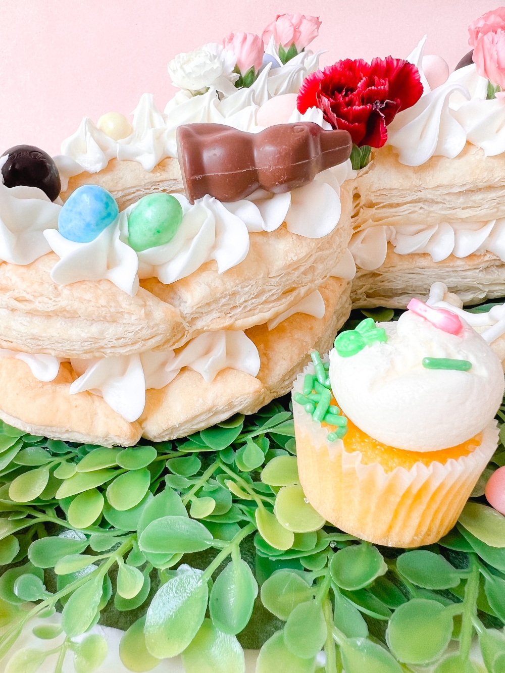 Bunny Puff Pastry Easter Tart. Layers of flaky crust and sweet cream cheese frosting make beautiful dessert  that also makes an edible centerpiece for your holiday table!