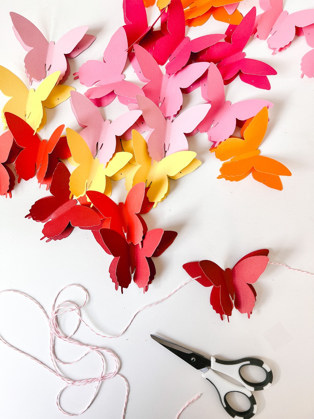 Rainbow Easter Mantel. Celebrate color this Easter by making a rainbow egg wreath and paper butterfly banner! 