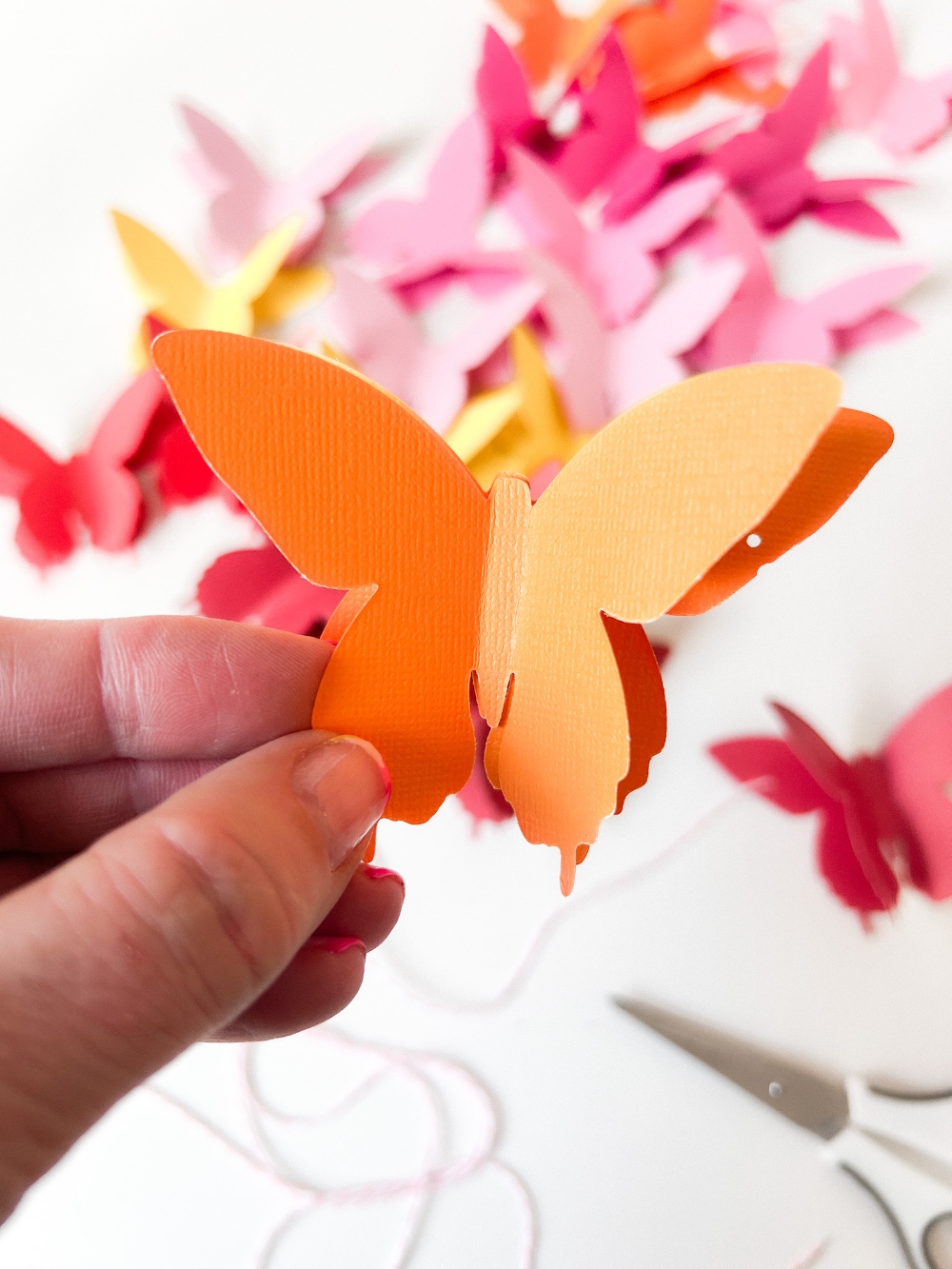 Rainbow Easter Mantel. Celebrate color this Easter by making a rainbow egg wreath and paper butterfly banner! 