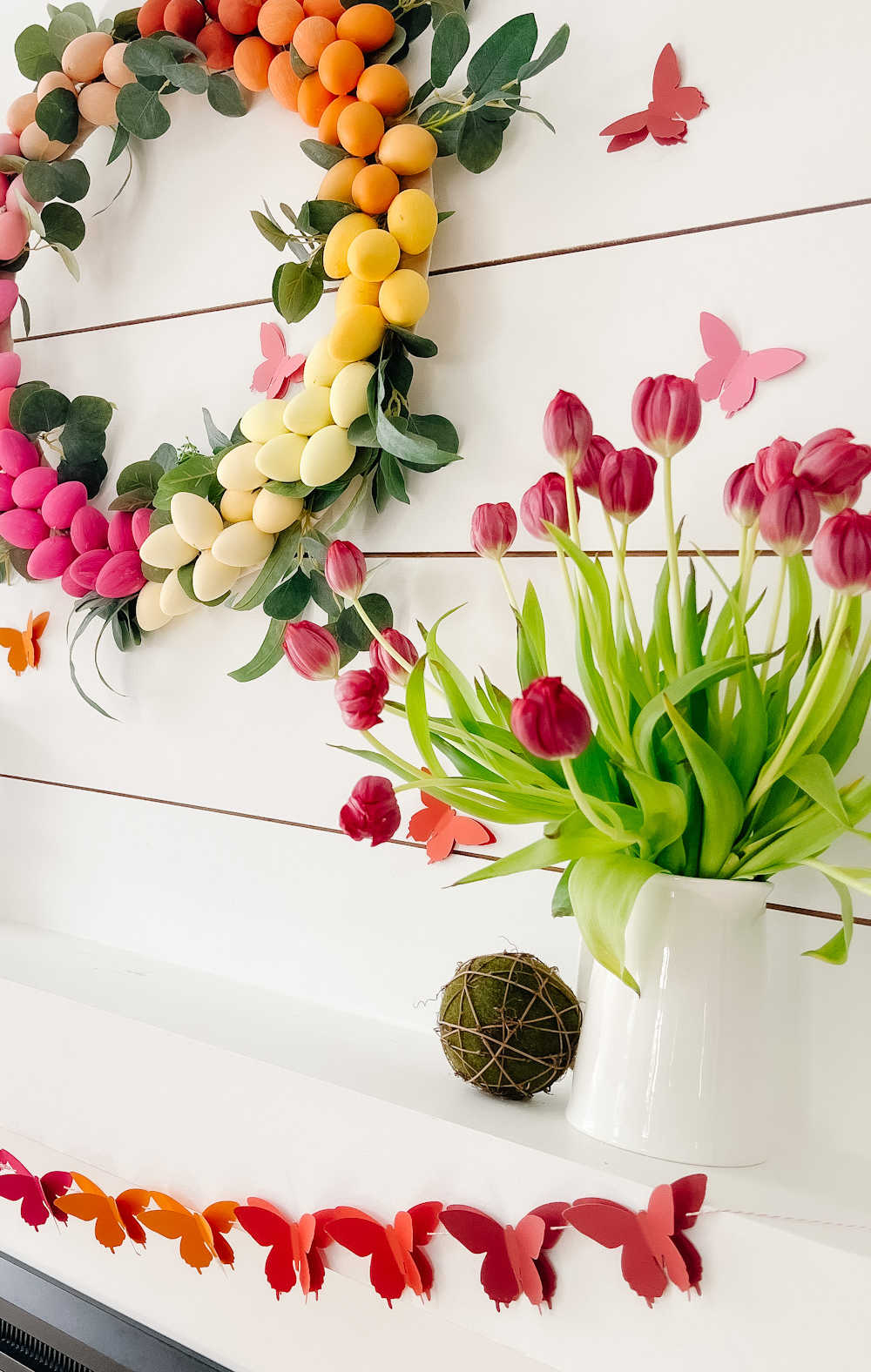 Rainbow Easter Mantel. Celebrate color this Easter by making a rainbow egg wreath and paper butterfly banner! 