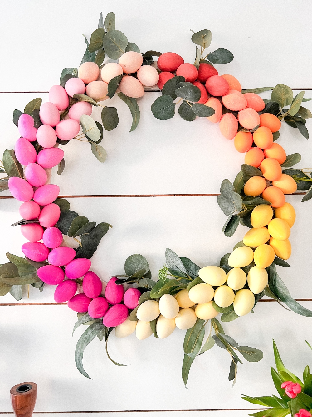 Colorful Ombre Easter Egg Wreath. Celebrate spring by creating a bright and colorful ombre egg wreath to match YOUR decor!