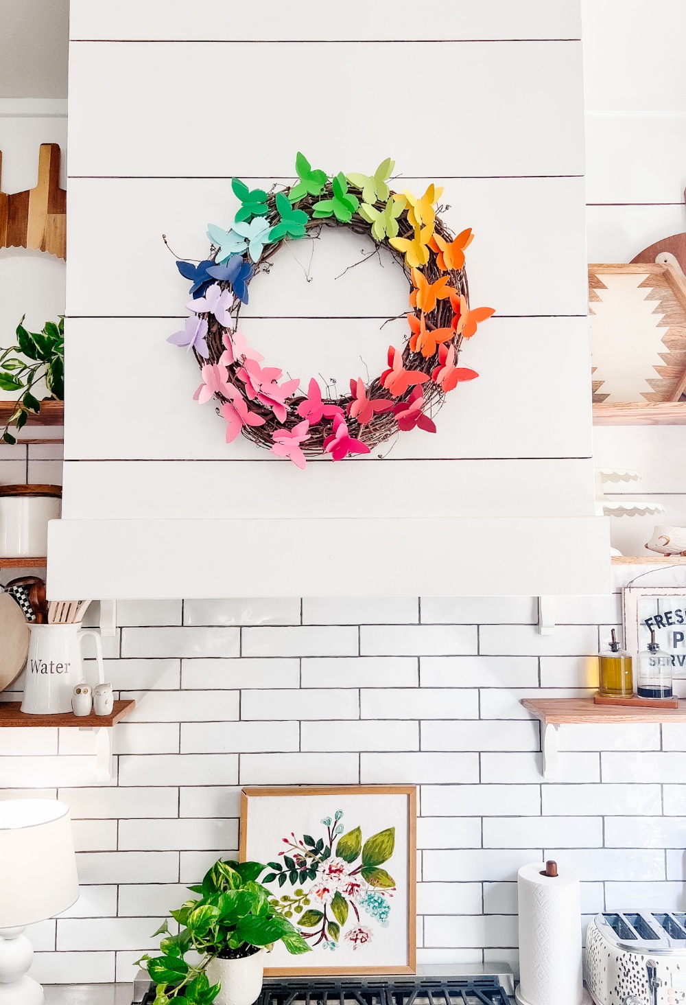 Easy Rainbow Butterfly Spring Wreath. Cut butterflies out of pretty paper for a happy rainbow wreath you can use all summer long! 