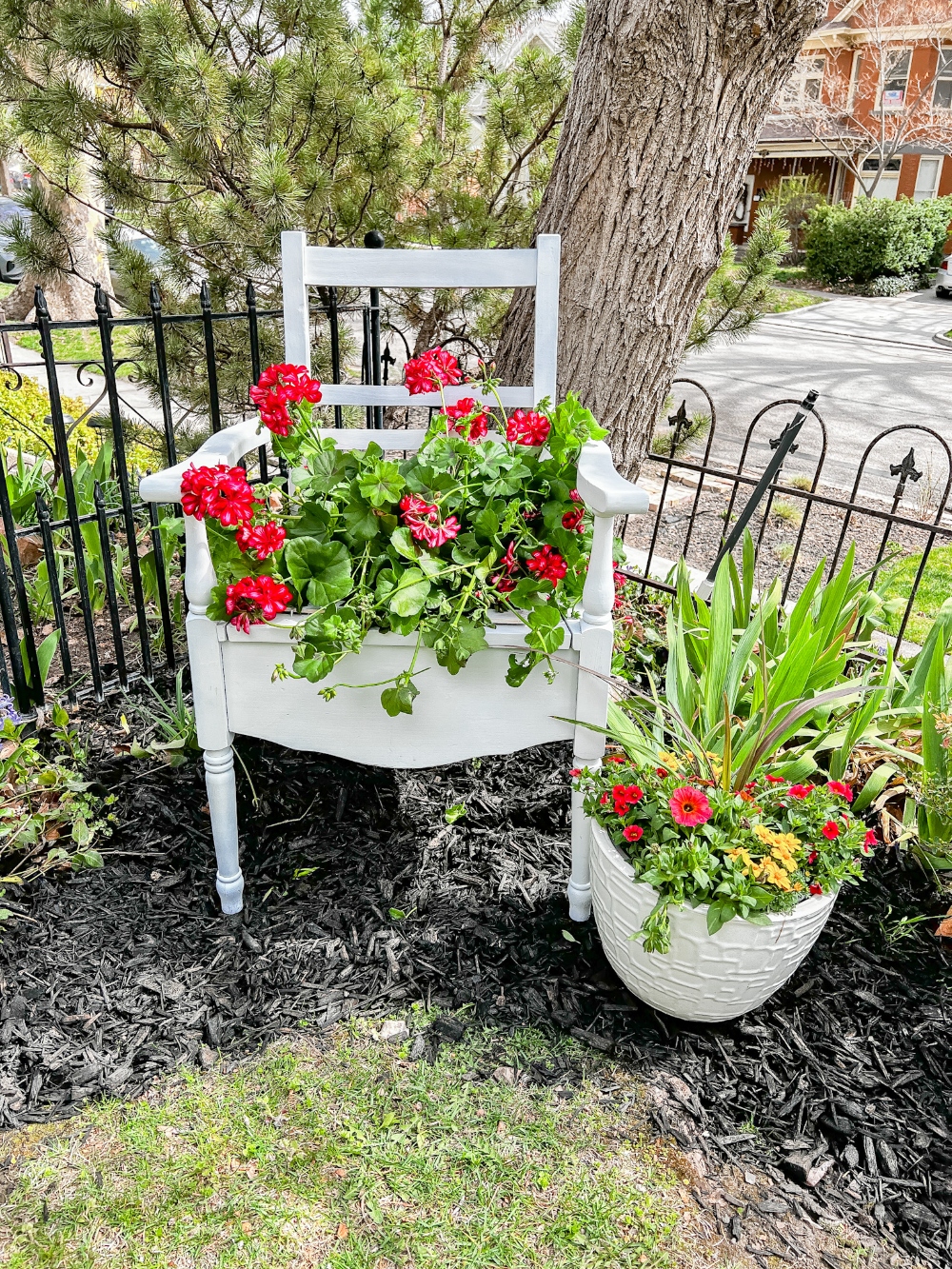 Spring DIY Upcycled Chair Planter. Take a broken chair and give it new life by planting beautiful flowers in it to enjoy in your yard!