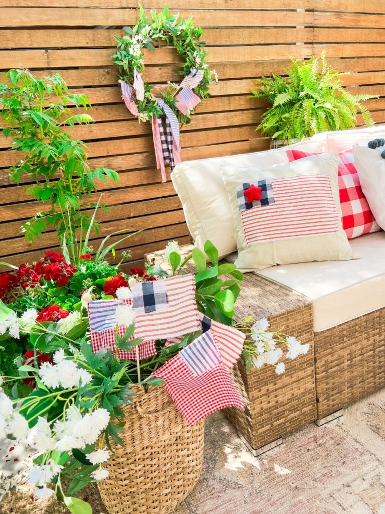 Easy Summer Fabric Flag Wreath. Create a fresh summer wreath with a patriotic twist with this green wreath with handmade fabric flags.