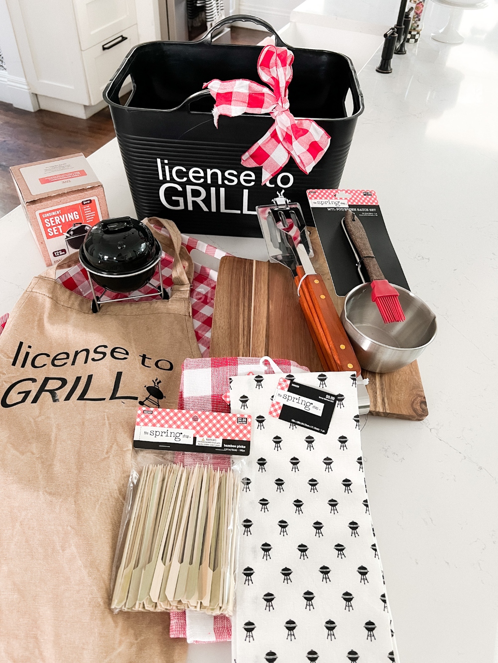 License to Grill Father's Day Gift Basket. Celebrate the dads in your life by creating a fun grilling gift basket with personalized basket and BBQ apron!