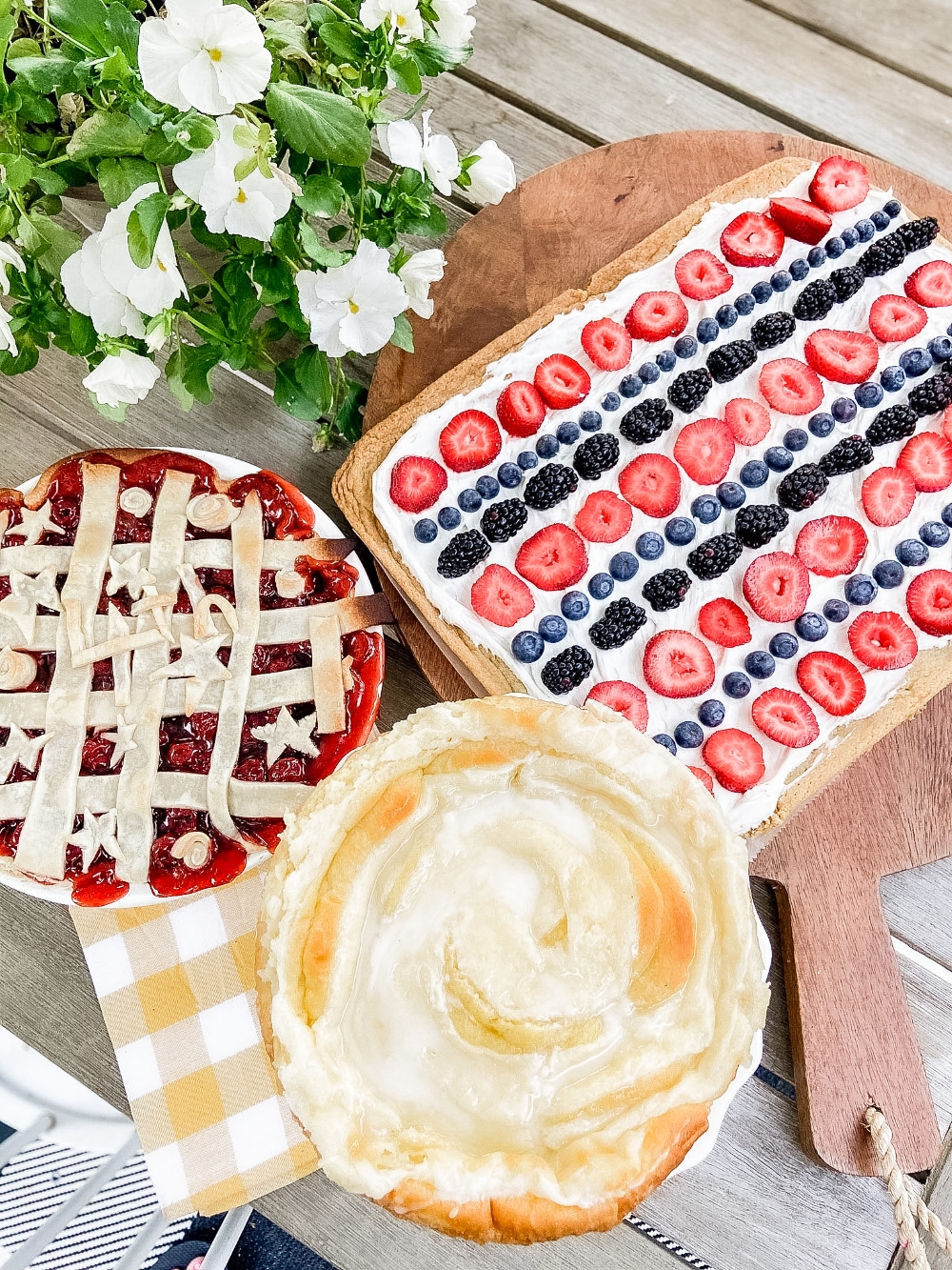 Patriotic Fruit Pizza Dessert. Chewy cookie crust is layered with light creamy topping and topped with fresh sweet berries for an easy semi-homemade summer dessert! 