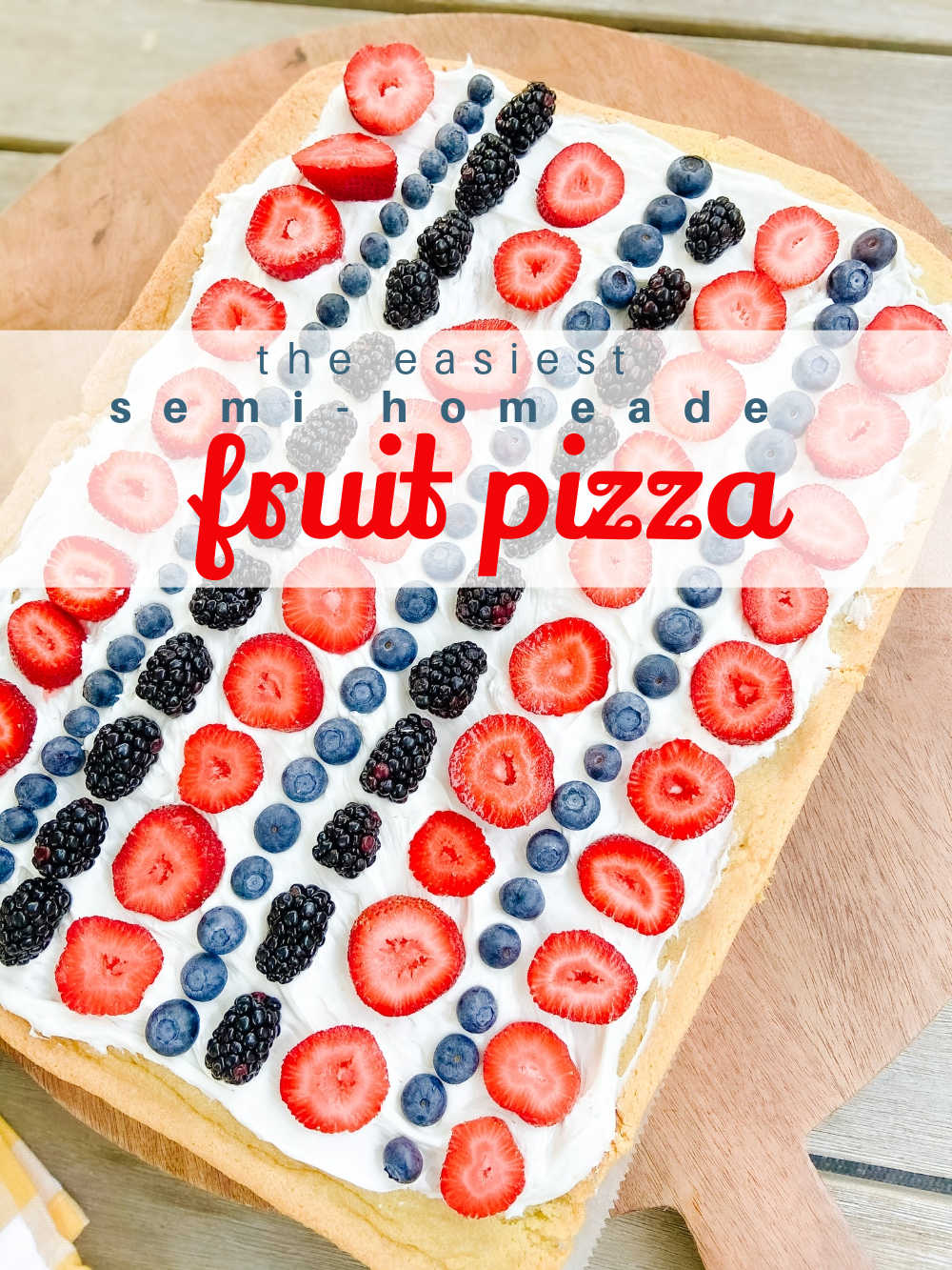 Patriotic Fruit Pizza Dessert. Chewy cookie crust is layered with light creamy topping and topped with fresh sweet berries for an easy semi-homemade summer dessert! 