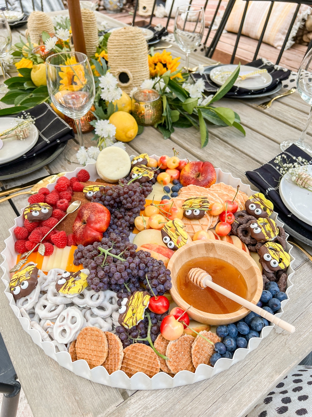 Honey-Themed Dessert Board with Pretzel Bees. Create a whimsical and delicious dessert board with sweet fruits, snacks and adorable pretzel bees.  